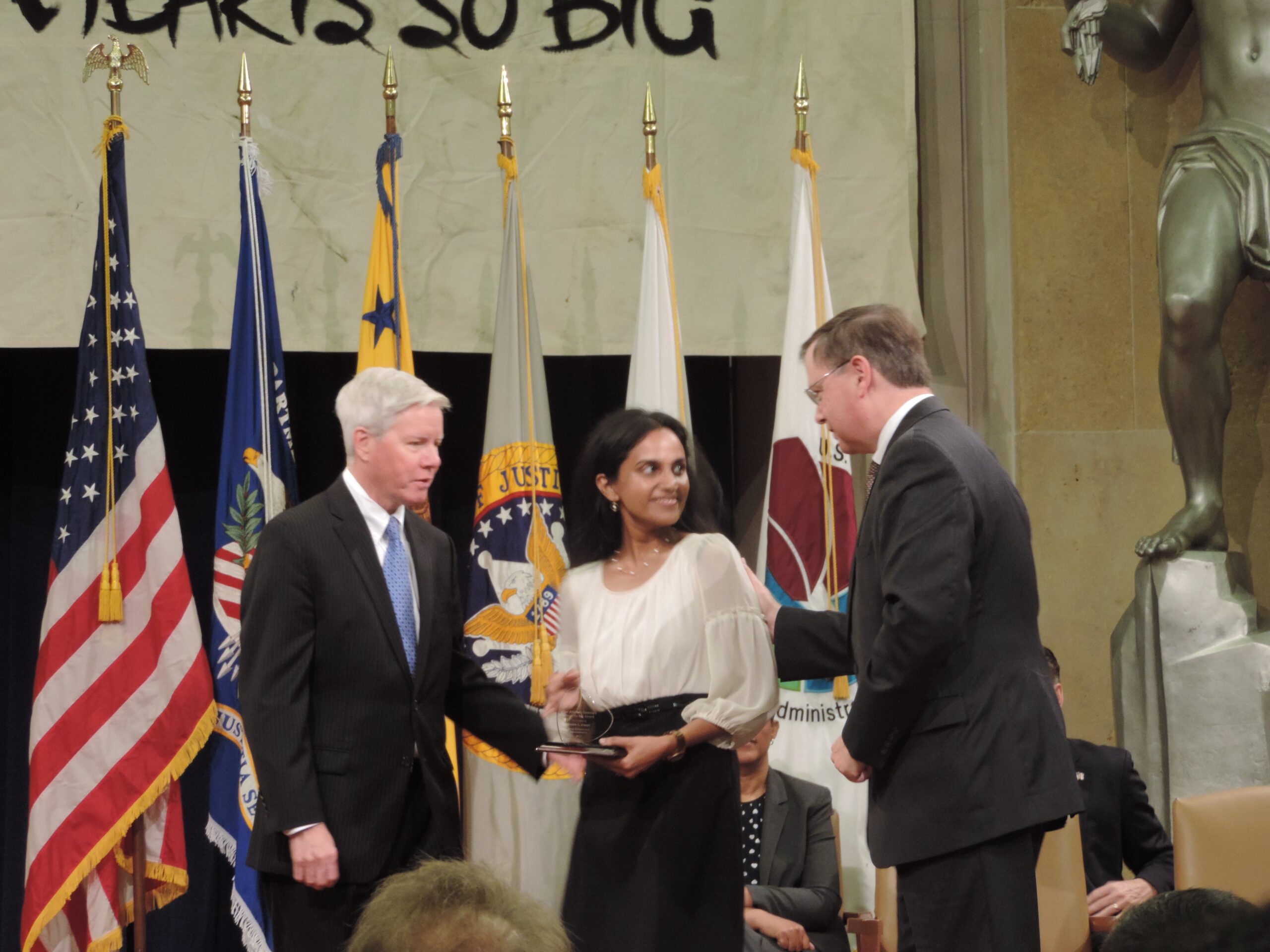 Babita receives a service award at the DEA.